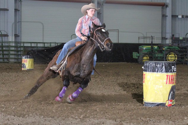 Mallory Coit races around a barrel