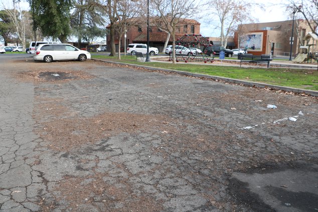 library parking lot pothole
