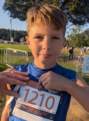 CJ Blevins shows of his bib