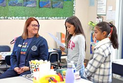Amy Peterman listens to reading