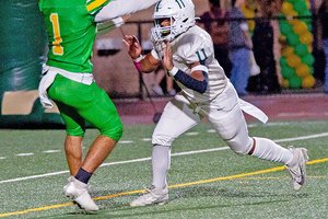 Damian Jackson pressures Grace Davis’ Caleb Zaragoza
