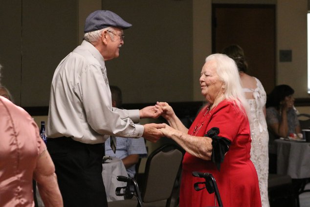 Lorenzo Cumbie dances with Jeannie Romero