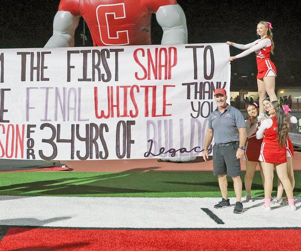 Brett Johnson with Bulldog cheerleaders