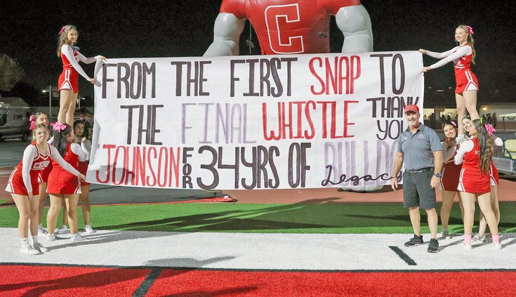 Brett Johnson with Bulldog cheerleaders