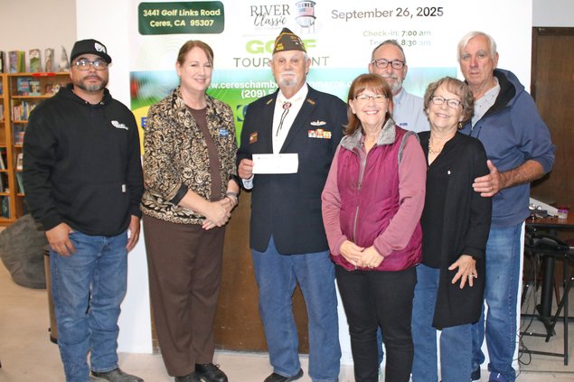 John Warren gets check