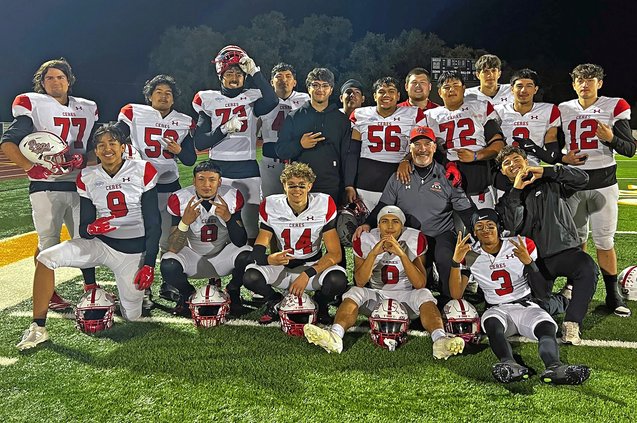football team poses with Johnson