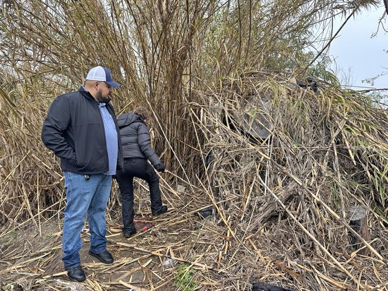 Lopez check out a makeshift homeless