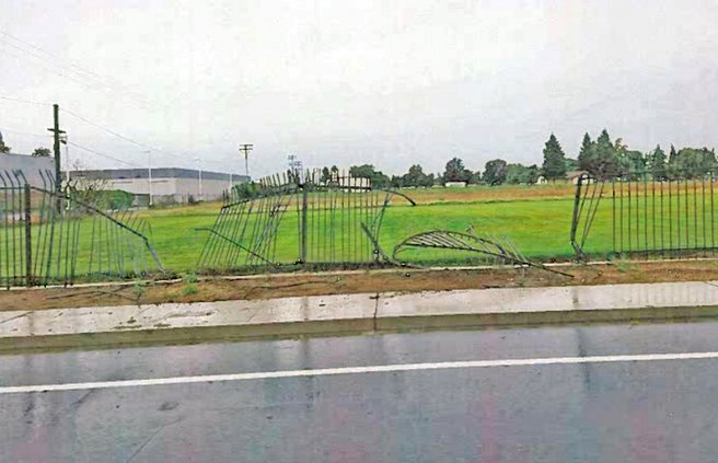 Wrecked fence at cemetery