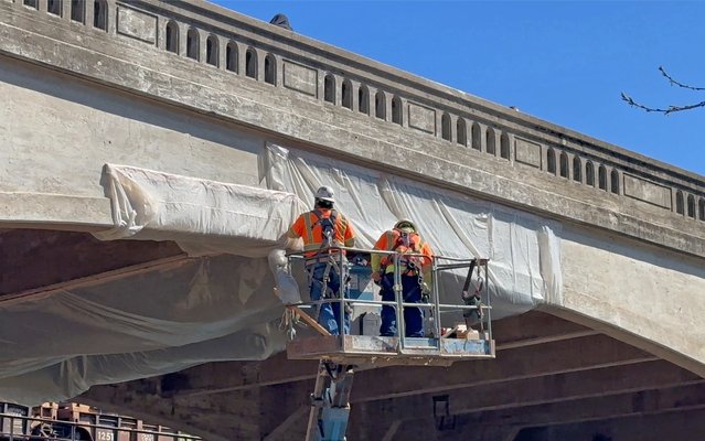 Crews wrapping bridge