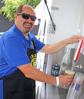 Joe Olvera pulls the tap