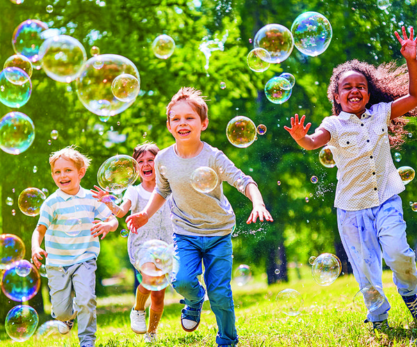 kids playing with bubbles
