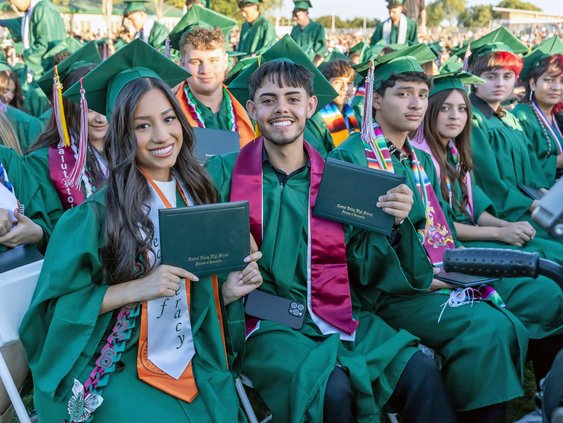 CVHS grads holding folder